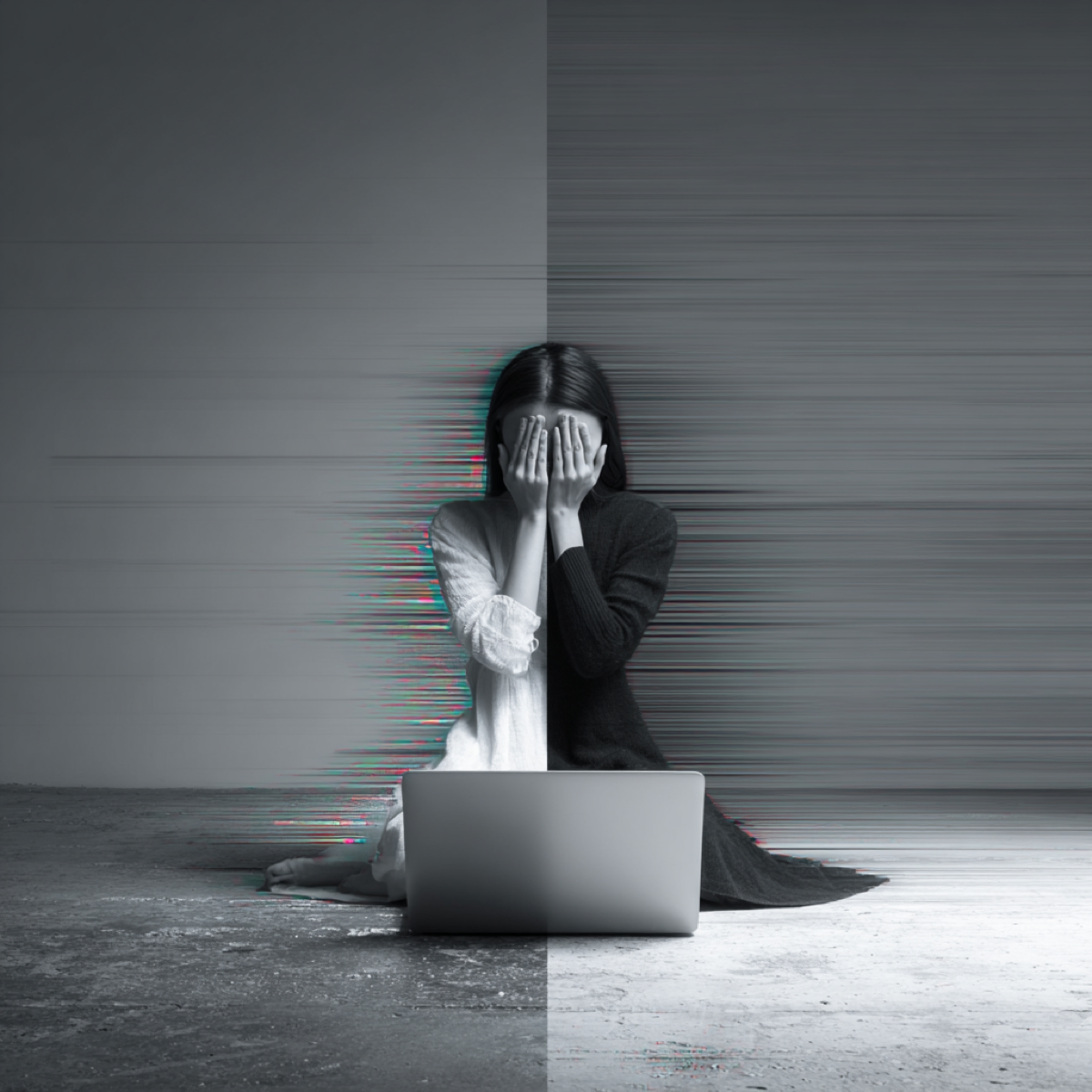 Act against deepfake removal threats now - distressed person with laptop displaying digital glitch effects representing urgency of immediate action against synthetic media threats