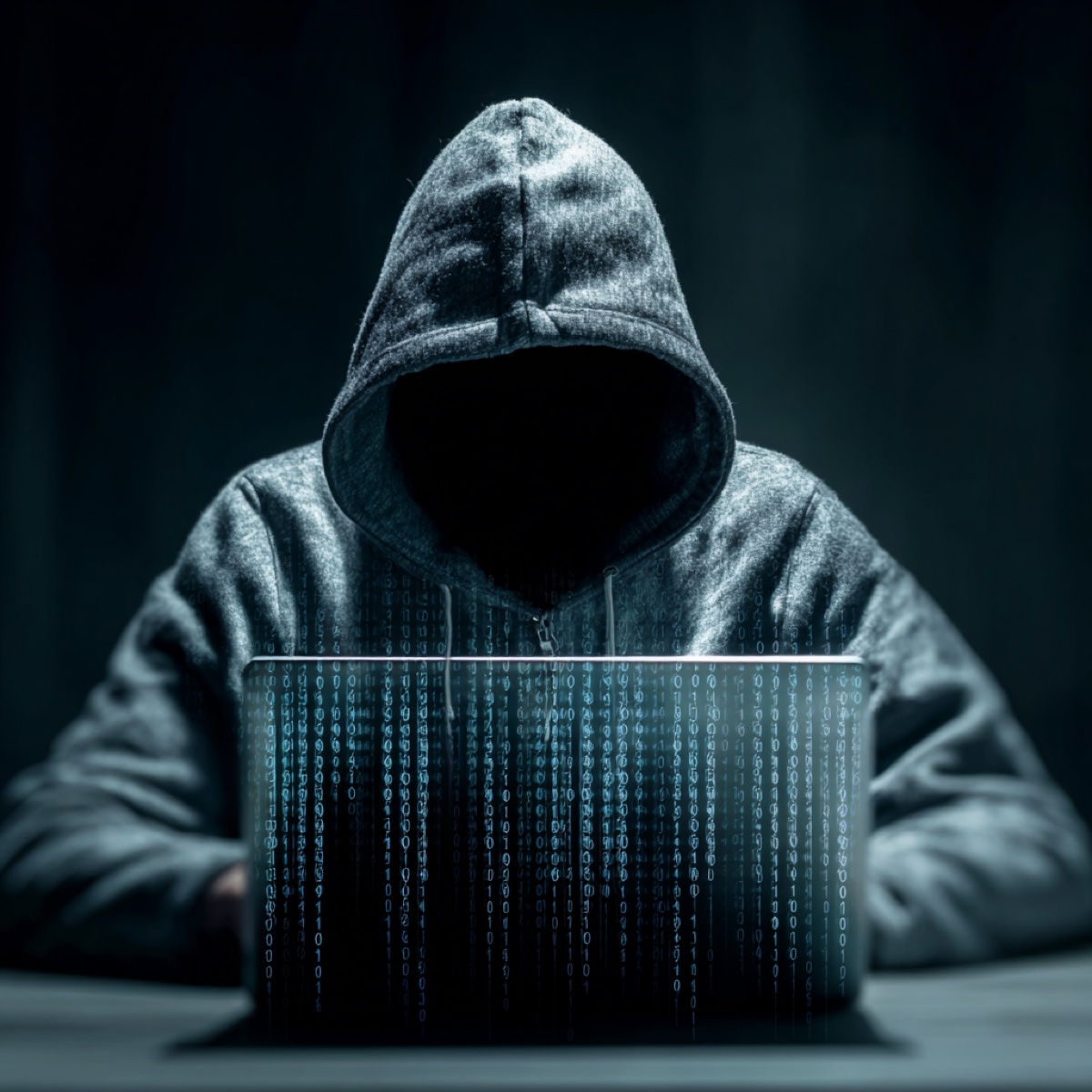 Cyber blackmail help why act now - hooded cybercriminal threat requiring immediate professional cybersecurity intervention